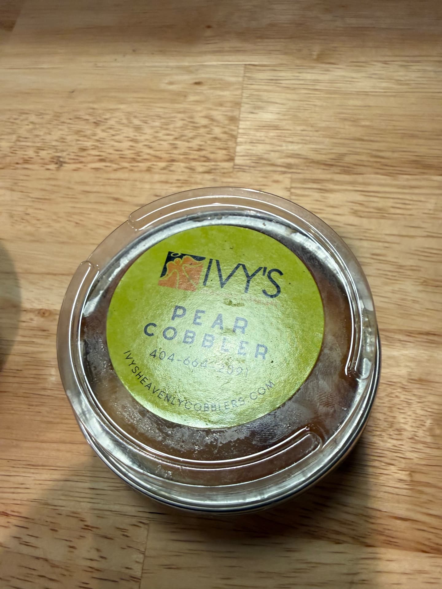 Ivy's pear cobbler cup with green label