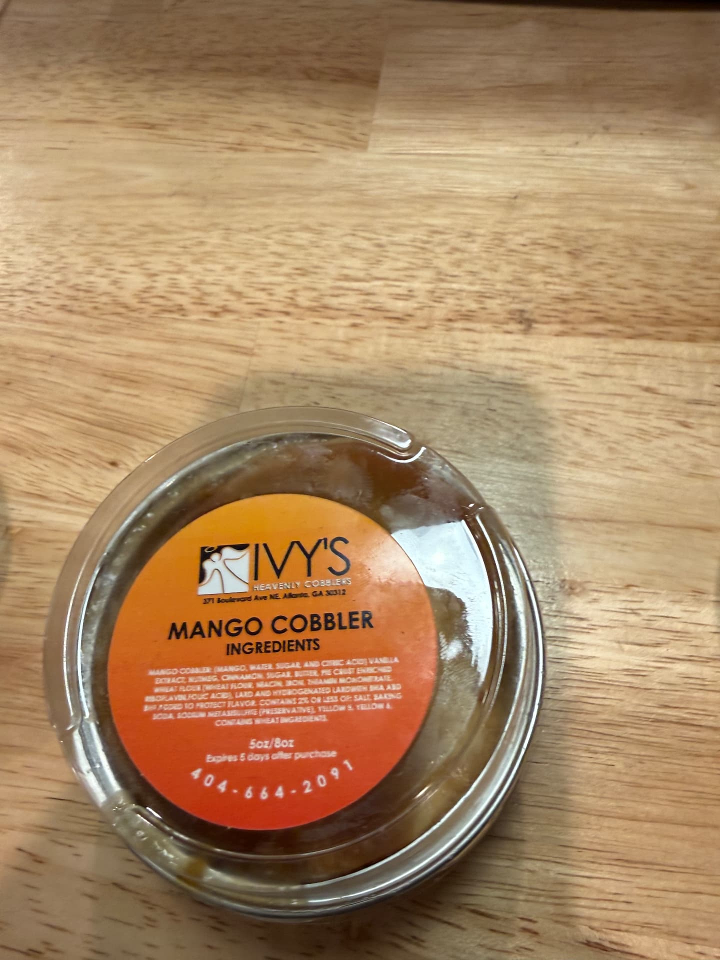 Ivy's mango cobbler cup with ingredient label