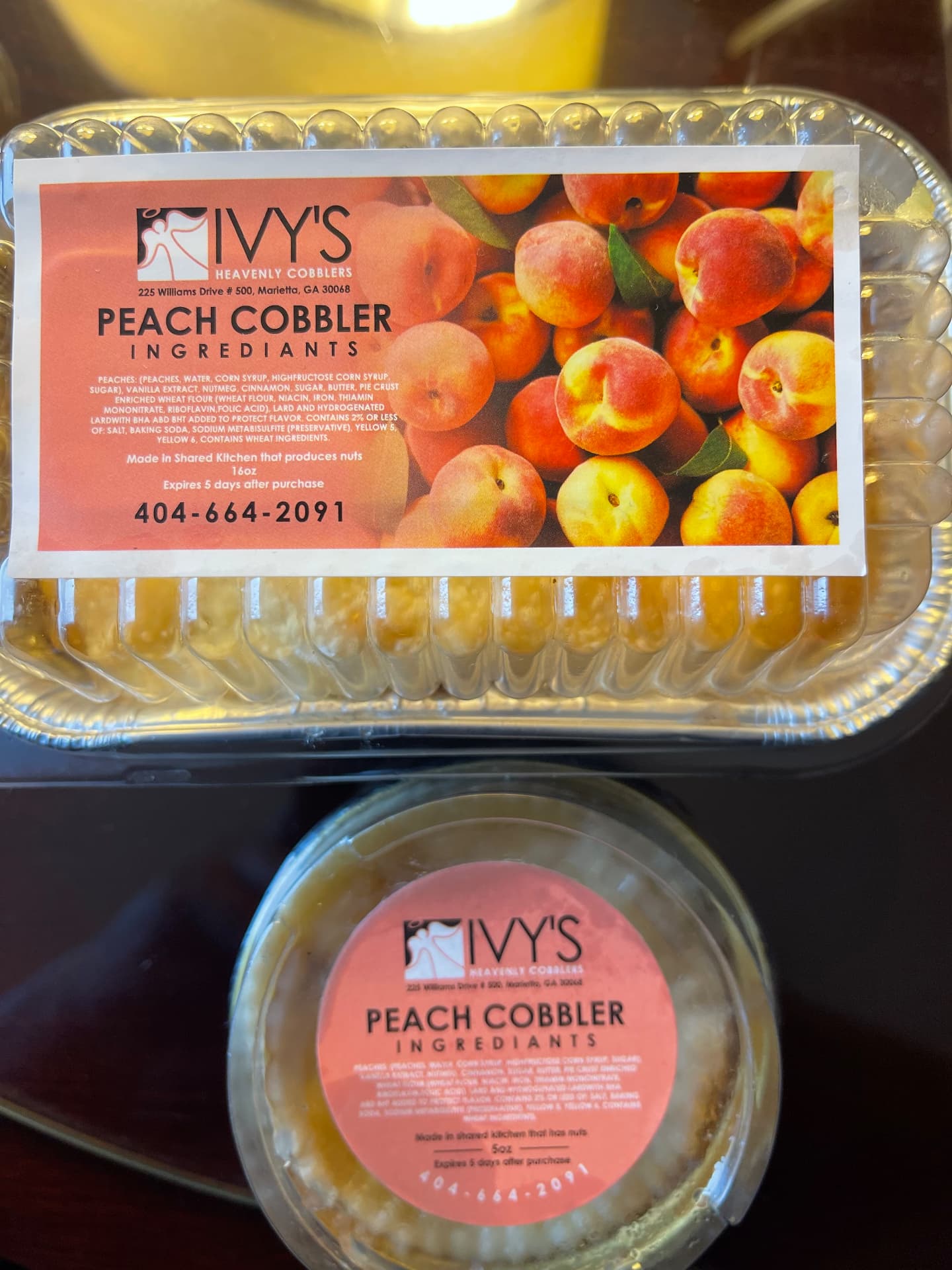 16 oz and 5 oz Ivy's peach cobbler containers with ingredient labels