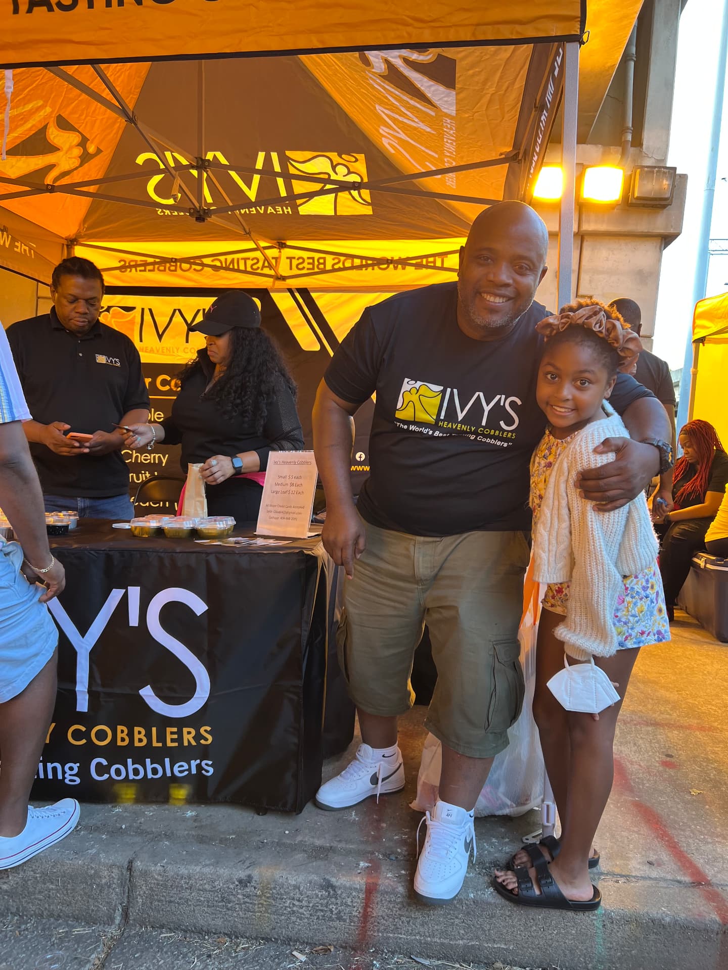 Customers smiling at the Ivy's Heavenly Cobblers booth